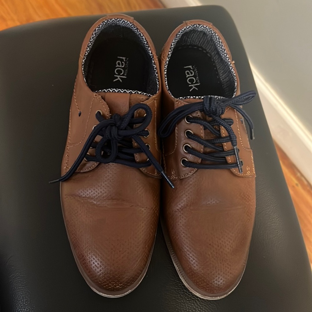 Brown boy shoes with navy blue laces